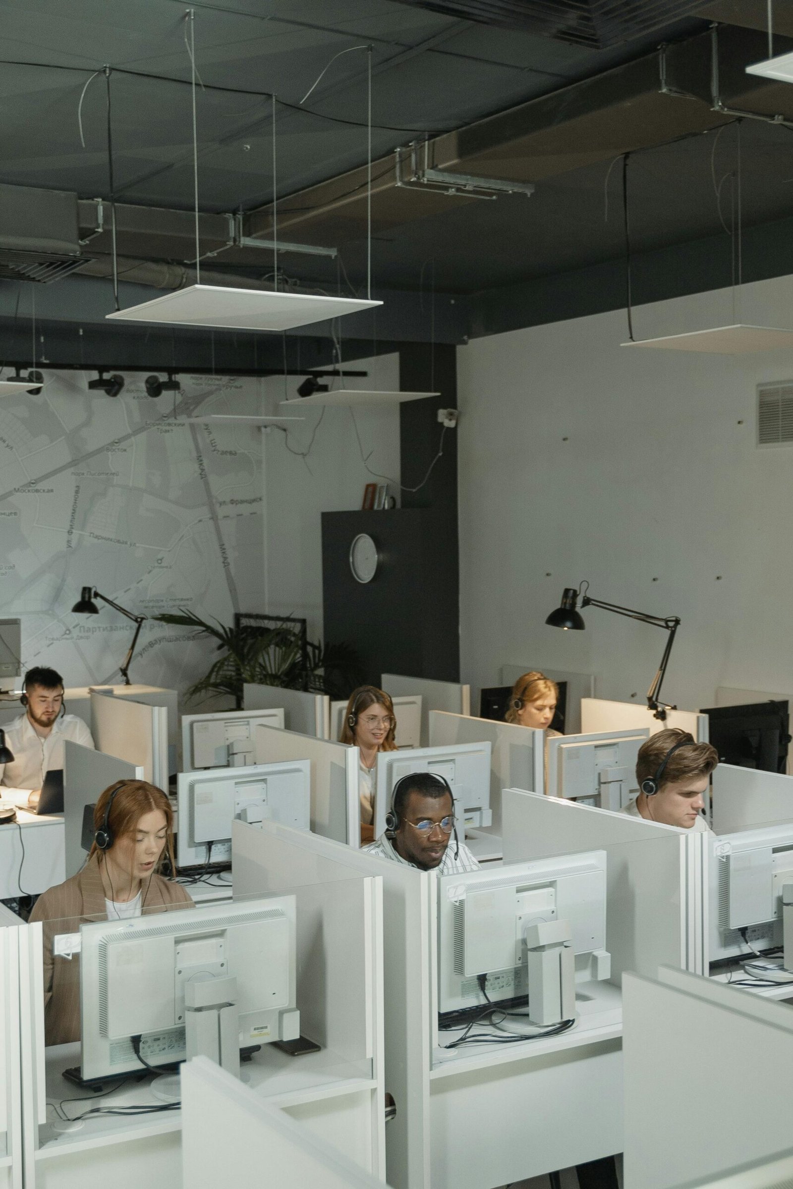 Corporate office team working at desktop computer workstations